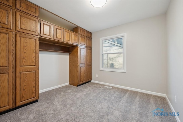 unfurnished bedroom with light carpet