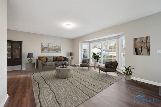 living room with dark hardwood / wood-style floors