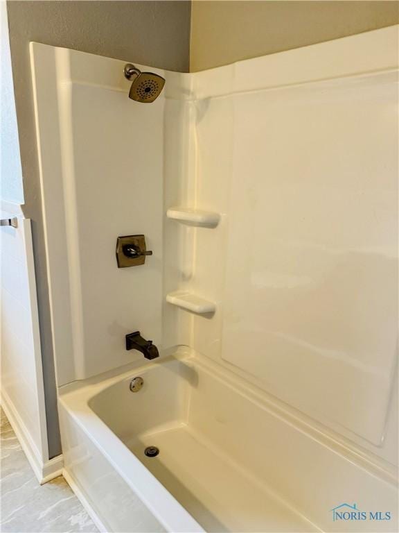 bathroom with shower / bathtub combination