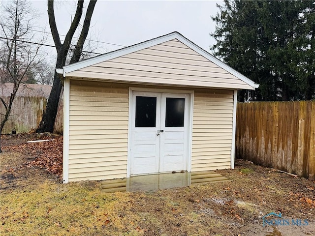 view of shed with fence