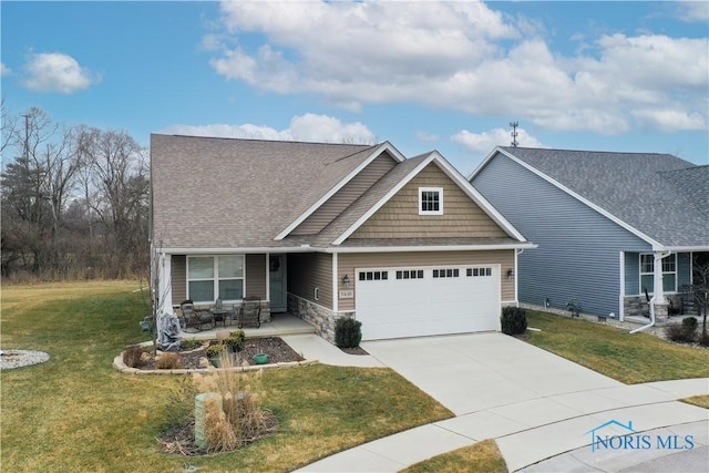 craftsman-style house with a porch, a garage, and a front yard