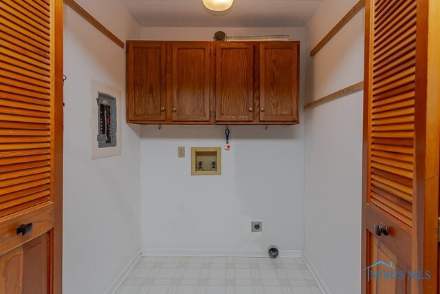 clothes washing area featuring washer hookup, electric dryer hookup, electric panel, and cabinets