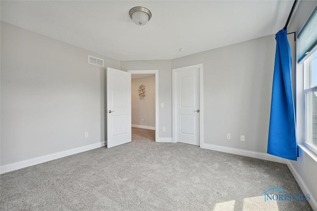 unfurnished bedroom with carpet flooring