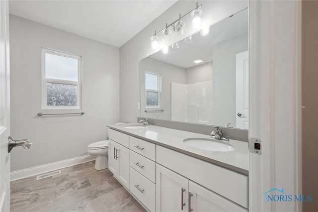 bathroom with vanity and toilet