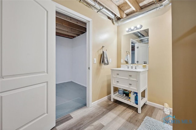 bathroom featuring vanity and wood-type flooring