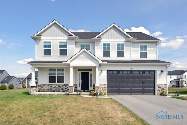 craftsman-style home with a garage and a front yard