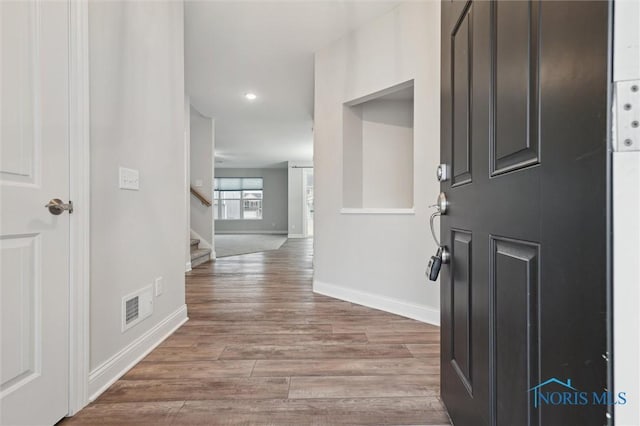 entrance foyer featuring hardwood / wood-style floors