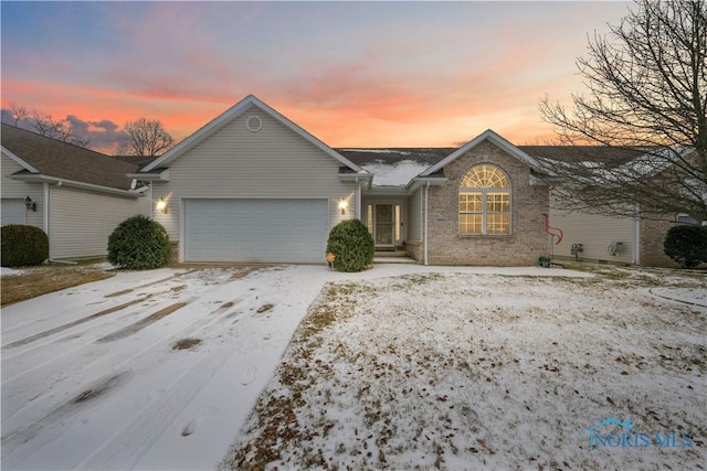 single story home with a garage