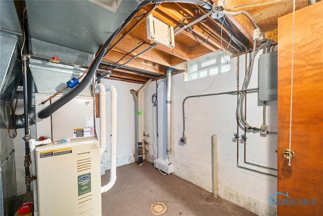 utility room featuring water heater