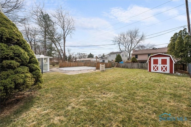 view of yard featuring a patio and a storage unit