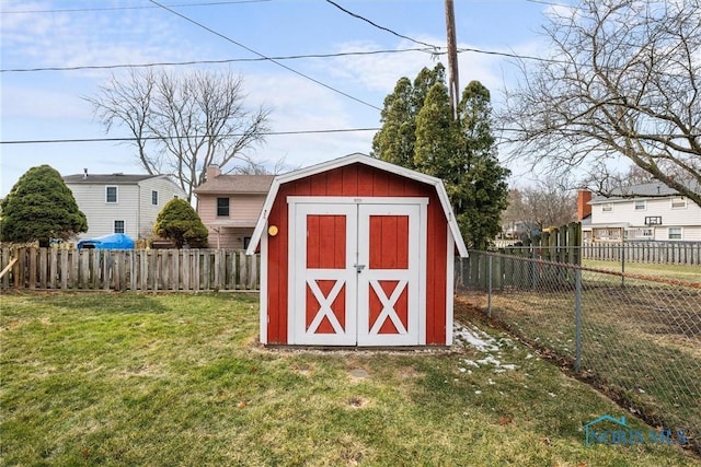 view of outbuilding featuring a yard