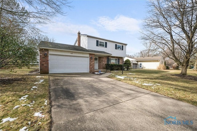 view of front property with a garage and a front lawn