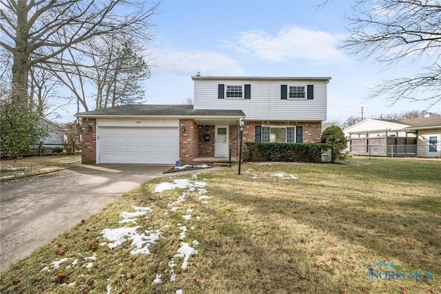 view of property featuring a garage and a front lawn