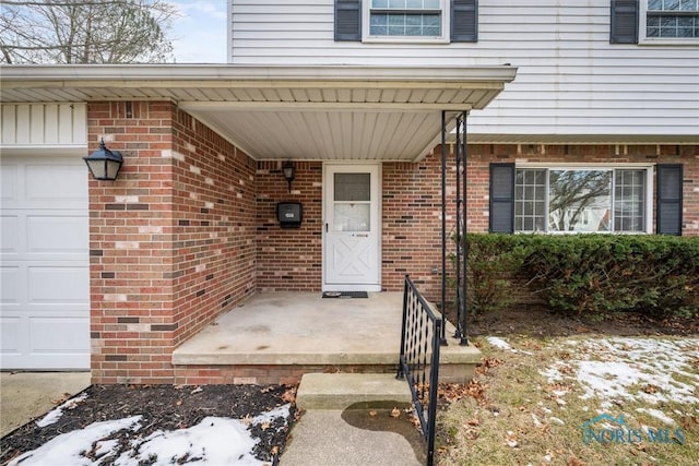 property entrance with a garage