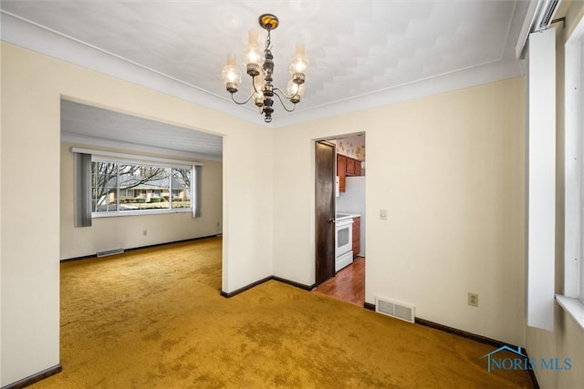 unfurnished dining area with carpet flooring and an inviting chandelier