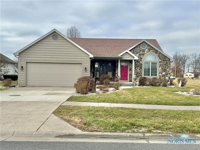 ranch-style home with a garage and a front yard