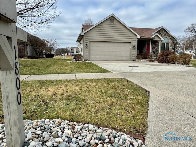 single story home with a front lawn and a garage