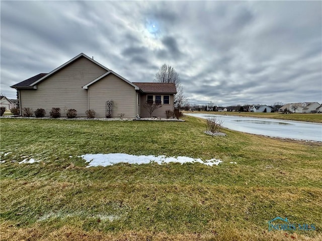 view of property exterior featuring a yard