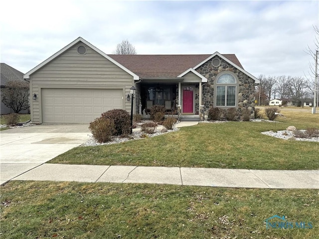 single story home featuring a garage and a front lawn