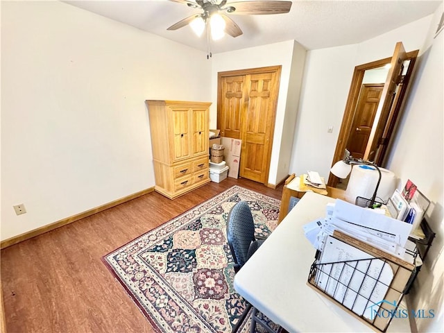 office featuring hardwood / wood-style floors and ceiling fan