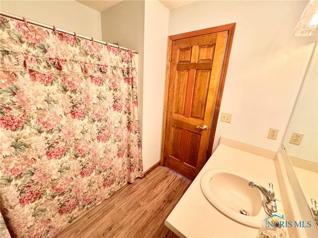 bathroom featuring vanity and wood-type flooring