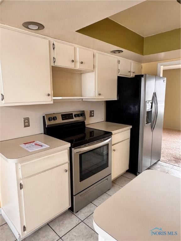 kitchen featuring appliances with stainless steel finishes and light tile patterned floors