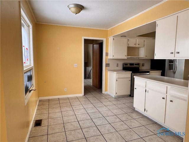 kitchen featuring white cabinetry, light tile patterned floors, ornamental molding, and appliances with stainless steel finishes