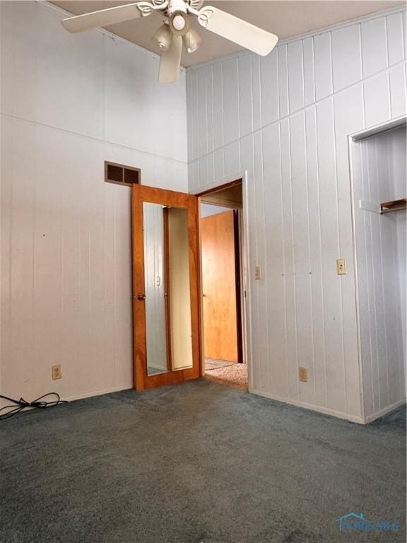 carpeted empty room with ceiling fan