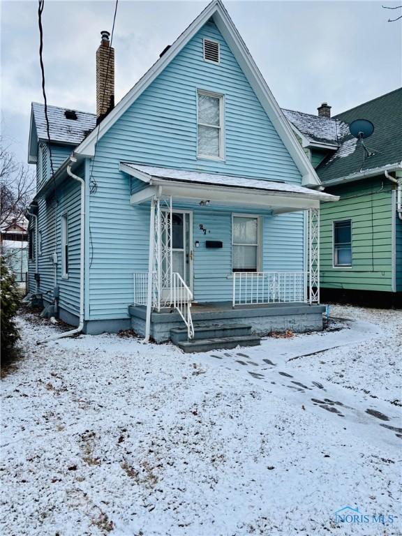 view of snow covered property