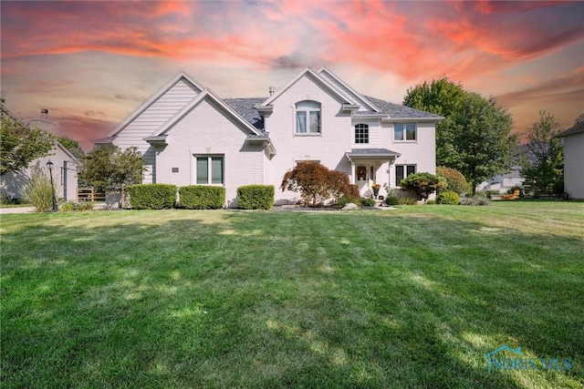 view of front of home with a lawn