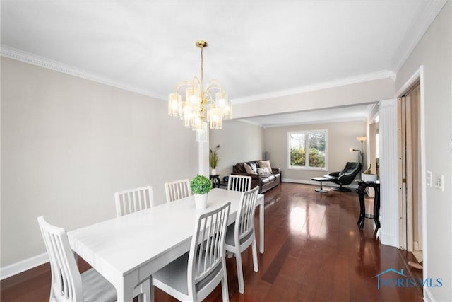 dining space with ornamental molding, dark hardwood / wood-style floors, and a chandelier