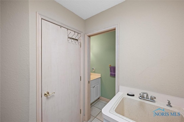 bathroom with vanity and tile patterned floors