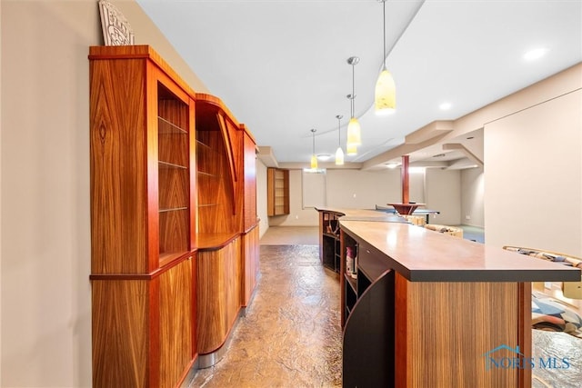 kitchen with decorative light fixtures and a kitchen island