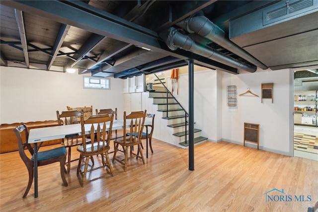 dining space featuring light wood-type flooring