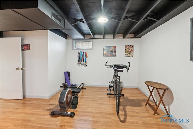 exercise area featuring wood-type flooring