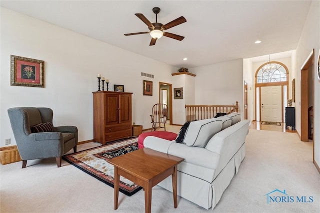 living room with light carpet and ceiling fan