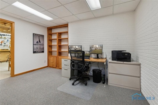 home office featuring a paneled ceiling and light colored carpet