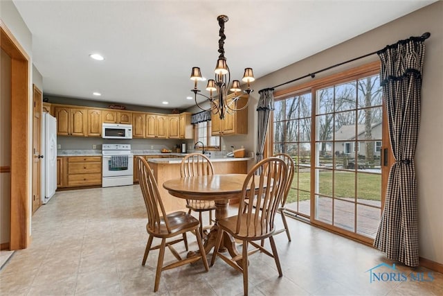 dining room with a notable chandelier