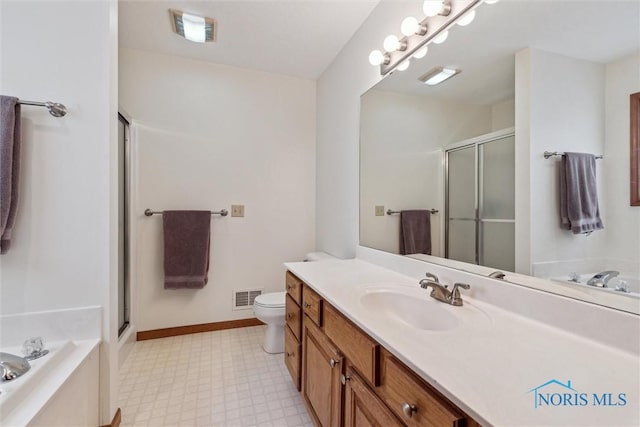 full bathroom featuring vanity, shower with separate bathtub, and toilet