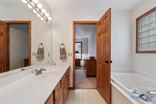 bathroom featuring vanity and a bathing tub