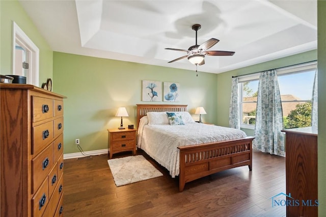 bedroom featuring dark hardwood / wood-style floors and ceiling fan