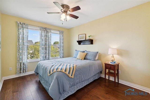 bedroom featuring dark hardwood / wood-style floors and ceiling fan