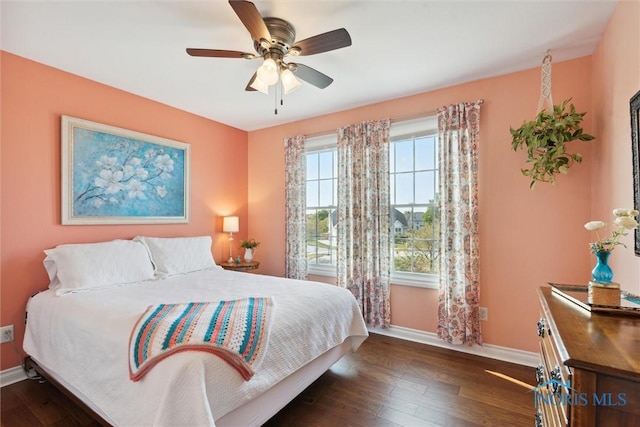 bedroom featuring dark hardwood / wood-style flooring and ceiling fan