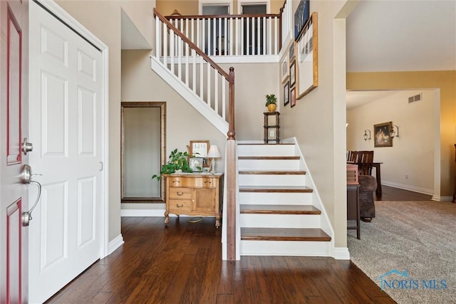 entryway with dark wood-type flooring