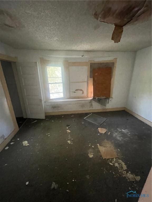 interior space featuring a textured ceiling