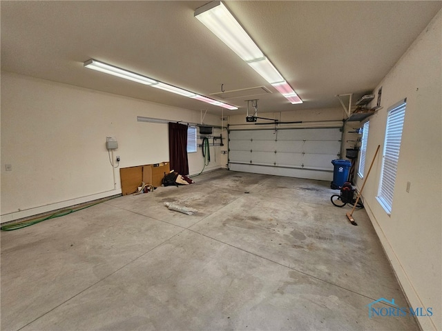 garage featuring a garage door opener