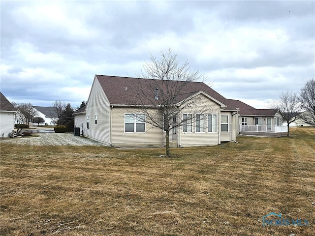 view of side of property with a lawn