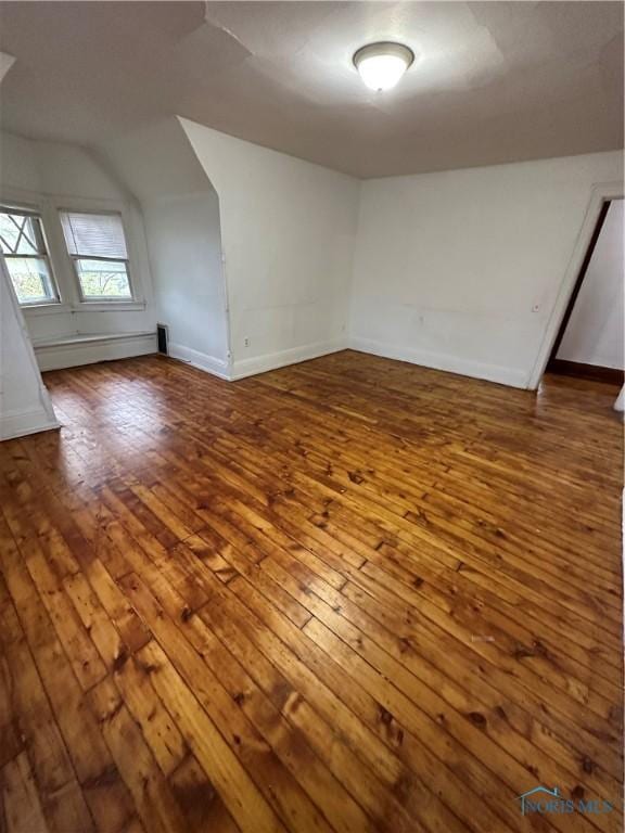 bonus room with hardwood / wood-style floors