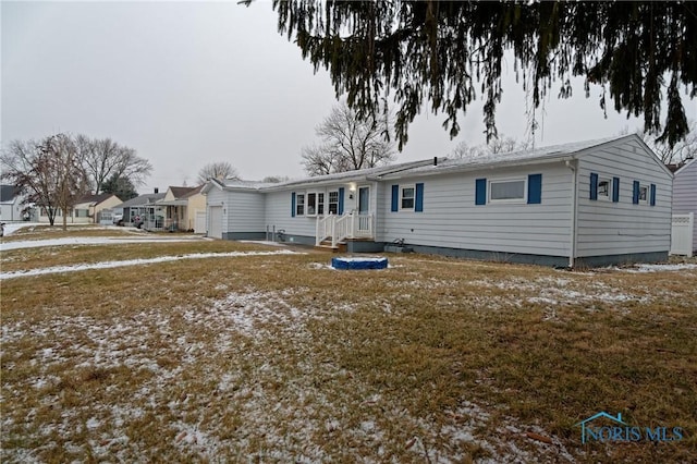 view of snow covered rear of property