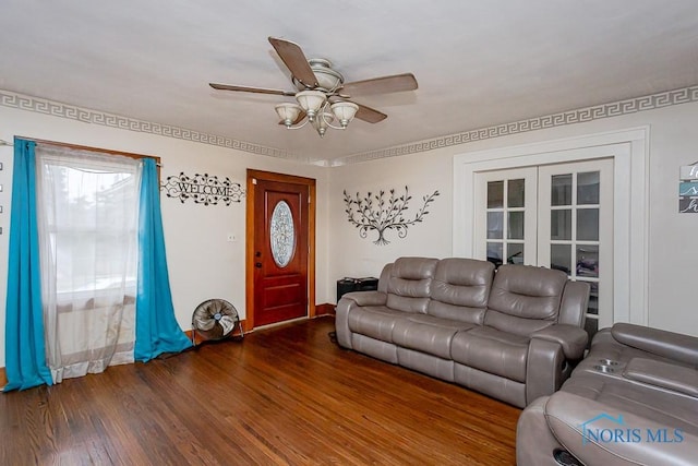 living room featuring dark wood-type flooring, french doors, and ceiling fan